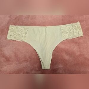 Elegant Lace Trimmed Women's Thong in Cream
